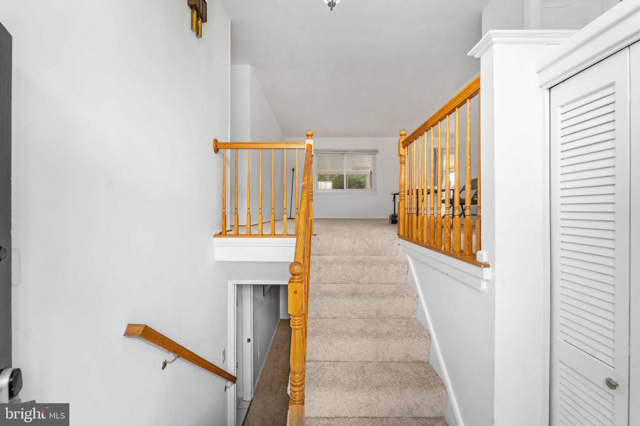 6423 Cabell Court Springfield, VA 22150 - Photo 3 of 58 Inviting staircase with warm wood accents.