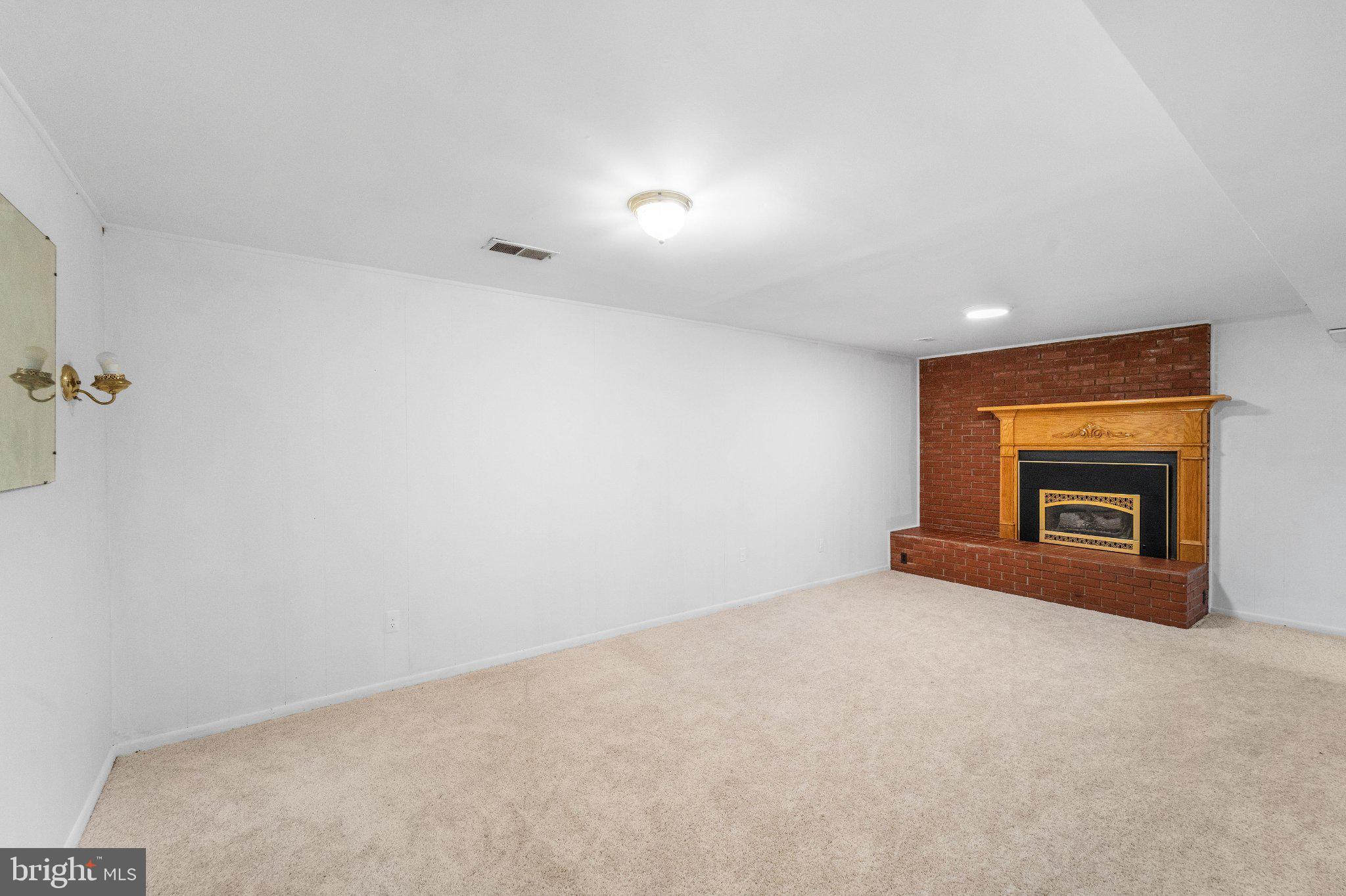 6423 Cabell Court Springfield, VA 22150 - Photo 33 of 58 a view of empty room with a fireplace