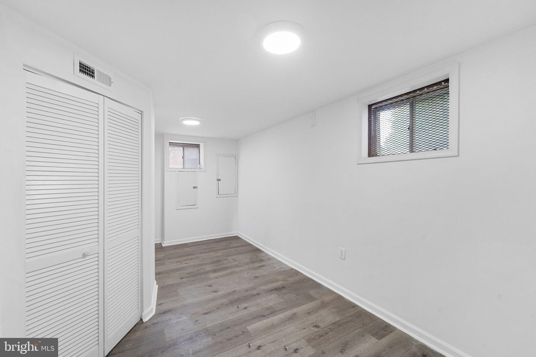6423 Cabell Court Springfield, VA 22150 - Photo 43 of 58 a view of an empty room with wooden floor and a window
