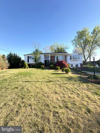 a view of a house with a big yard