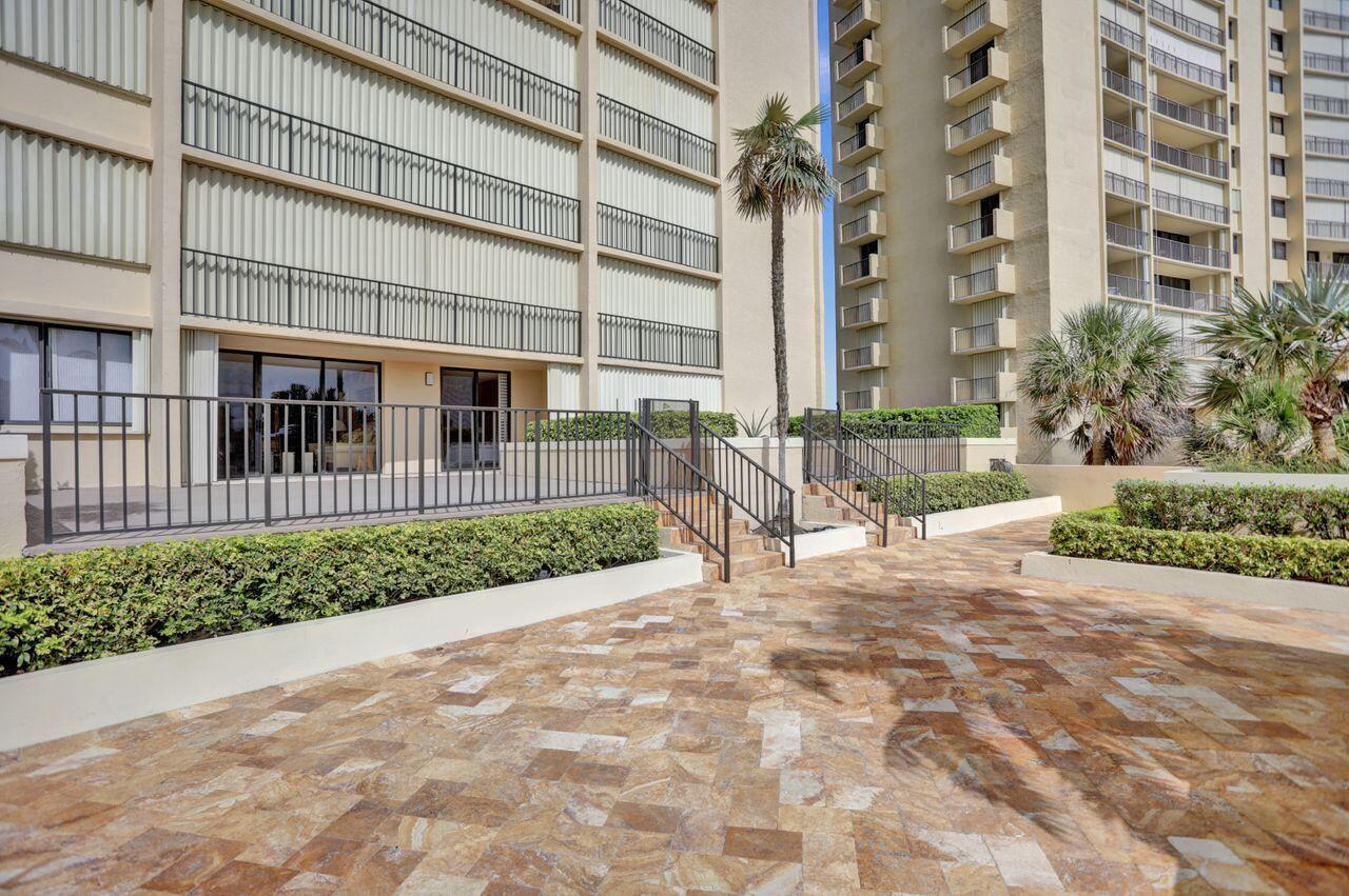 100 Ocean Trail Way, Unit 109 Jupiter, FL 33477 - Photo 15 of 27 a view of a building with a street