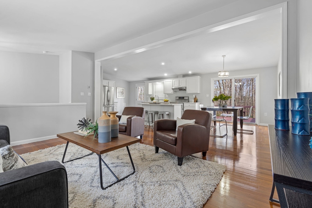 41 Casey Road Spencer, MA 01562 - Photo 13 of 39 a living room kitchen with furniture and kitchen view