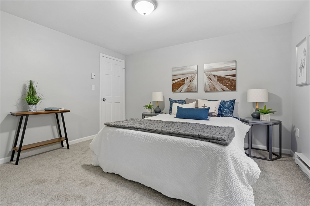 41 Casey Road Spencer, MA 01562 - Photo 16 of 39 a bedroom with a bed and a window