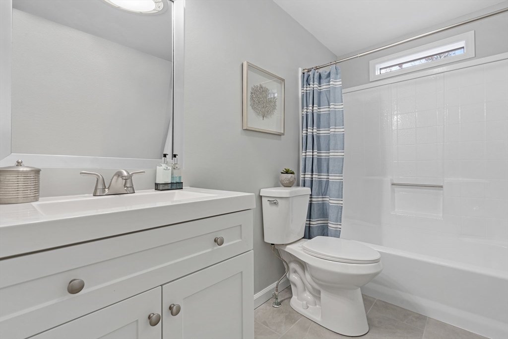 41 Casey Road Spencer, MA 01562 - Photo 18 of 39 a bathroom with a sink mirror vanity and toilet