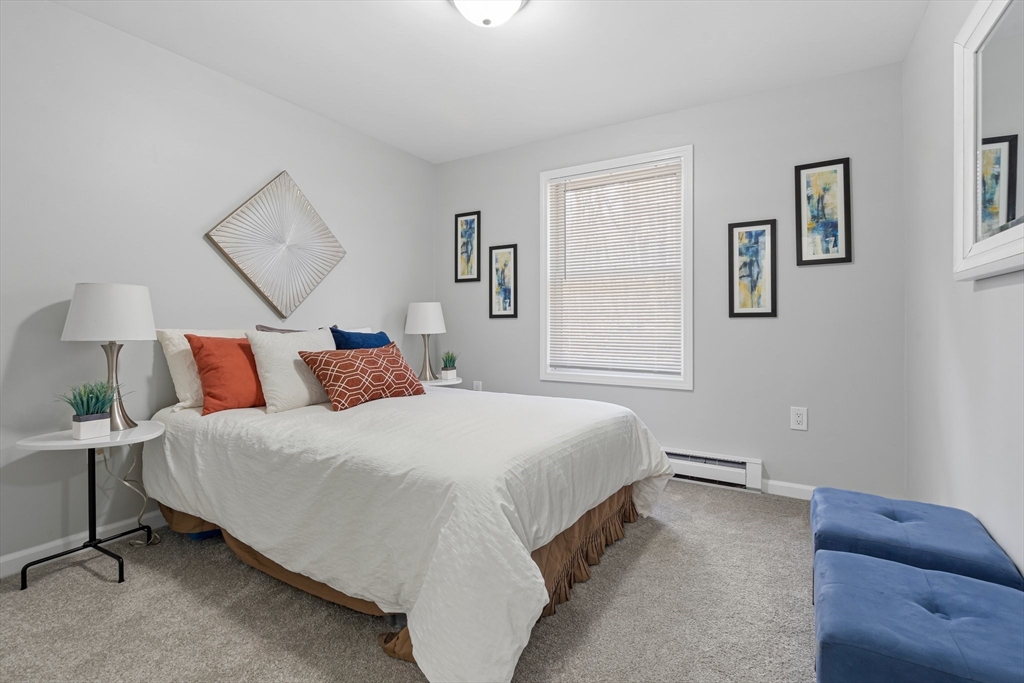 41 Casey Road Spencer, MA 01562 - Photo 19 of 39 a bedroom with bed and a couch