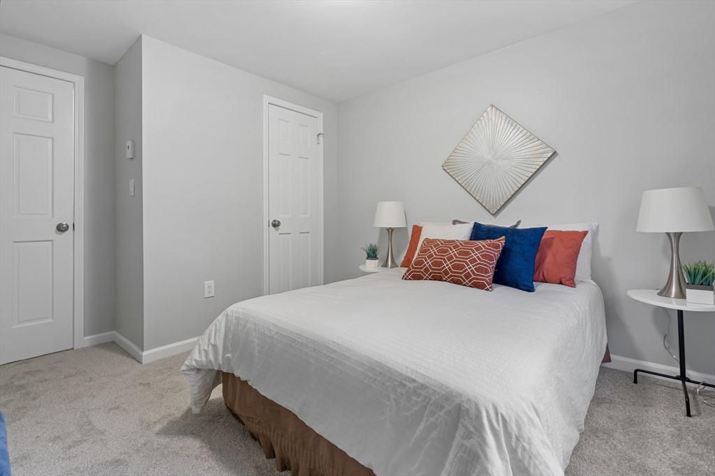 41 Casey Road Spencer, MA 01562 - Photo 20 of 39 a large bed sitting in a bedroom next to a lamp