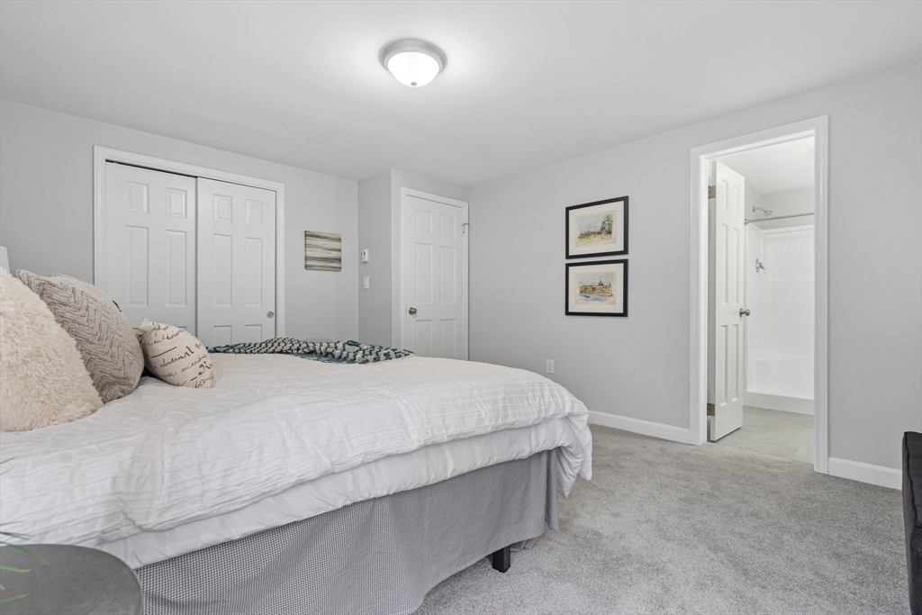 41 Casey Road Spencer, MA 01562 - Photo 22 of 39 a bedroom with a bed and a night stand