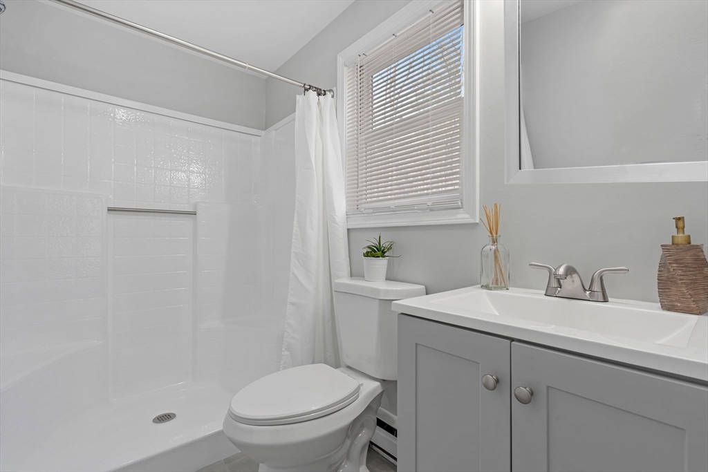 41 Casey Road Spencer, MA 01562 - Photo 23 of 39 a bathroom with a sink toilet and vanity