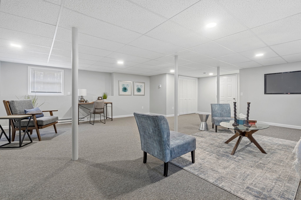 41 Casey Road Spencer, MA 01562 - Photo 26 of 39 a living room with furniture a rug and chairs