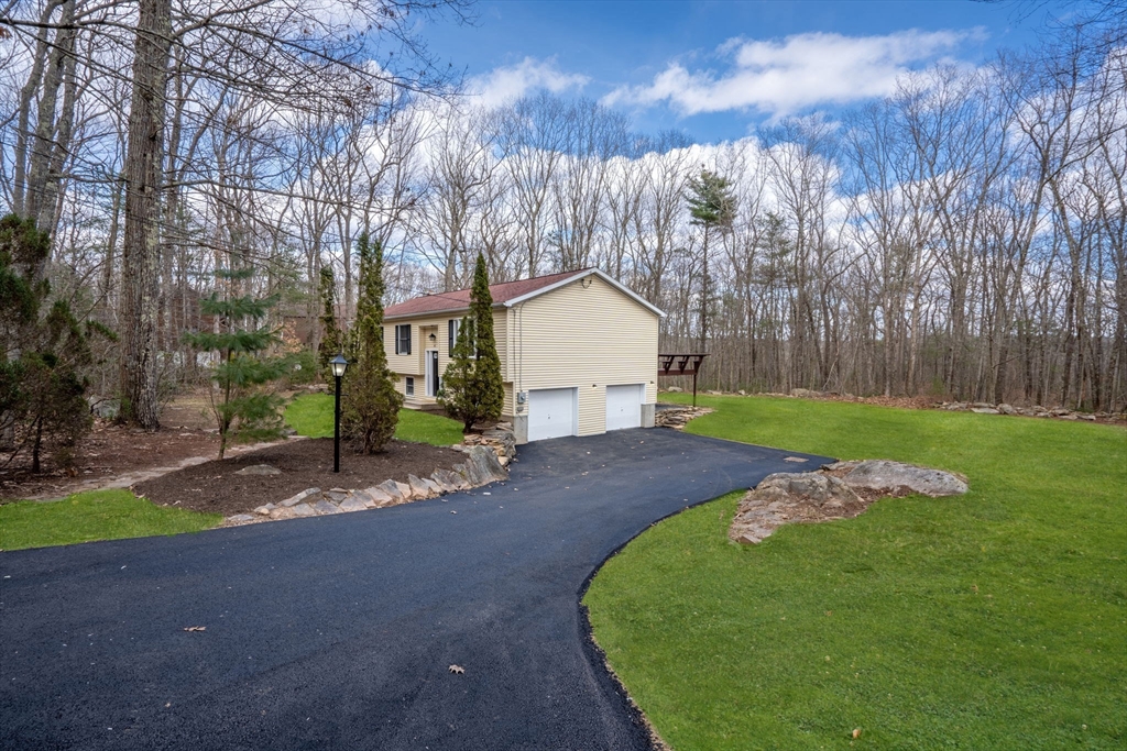 41 Casey Road Spencer, MA 01562 - Photo 31 of 39 a view of a house with backyard and trees