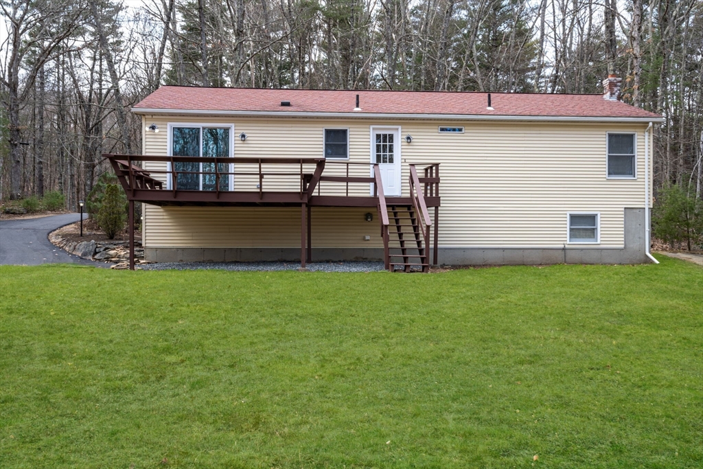 41 Casey Road Spencer, MA 01562 - Photo 33 of 39 a view of a house with a yard and sitting area