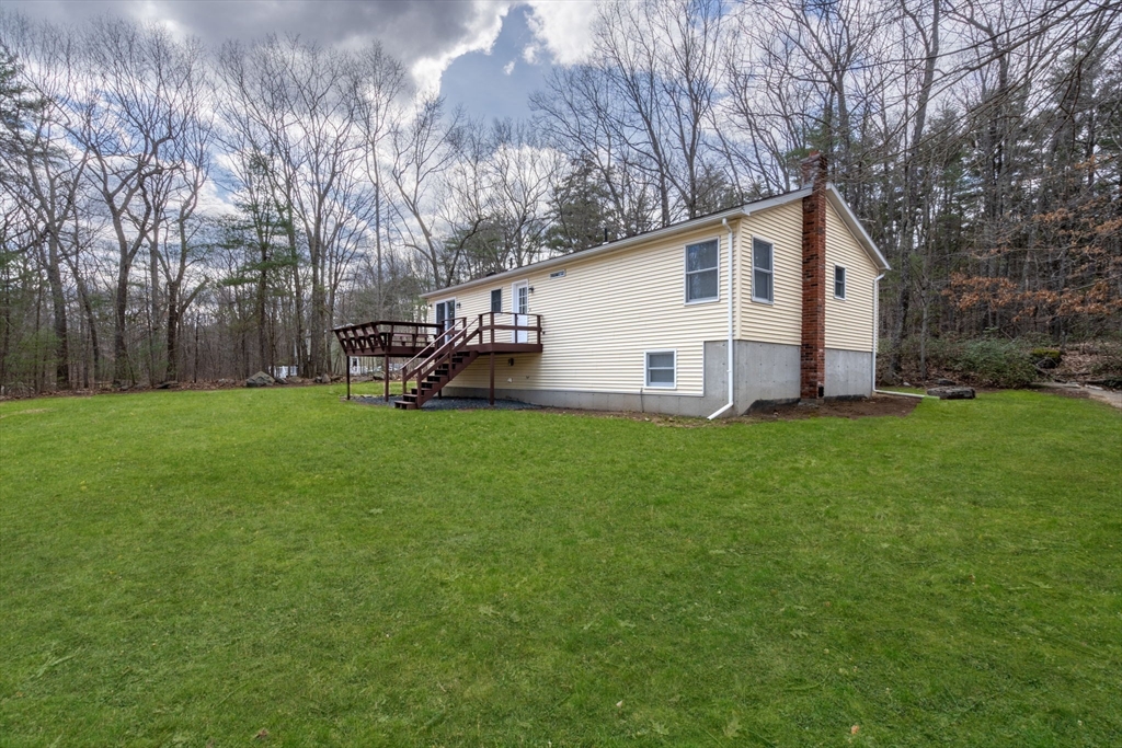 41 Casey Road Spencer, MA 01562 - Photo 34 of 39 a view of a house with backyard and sitting area