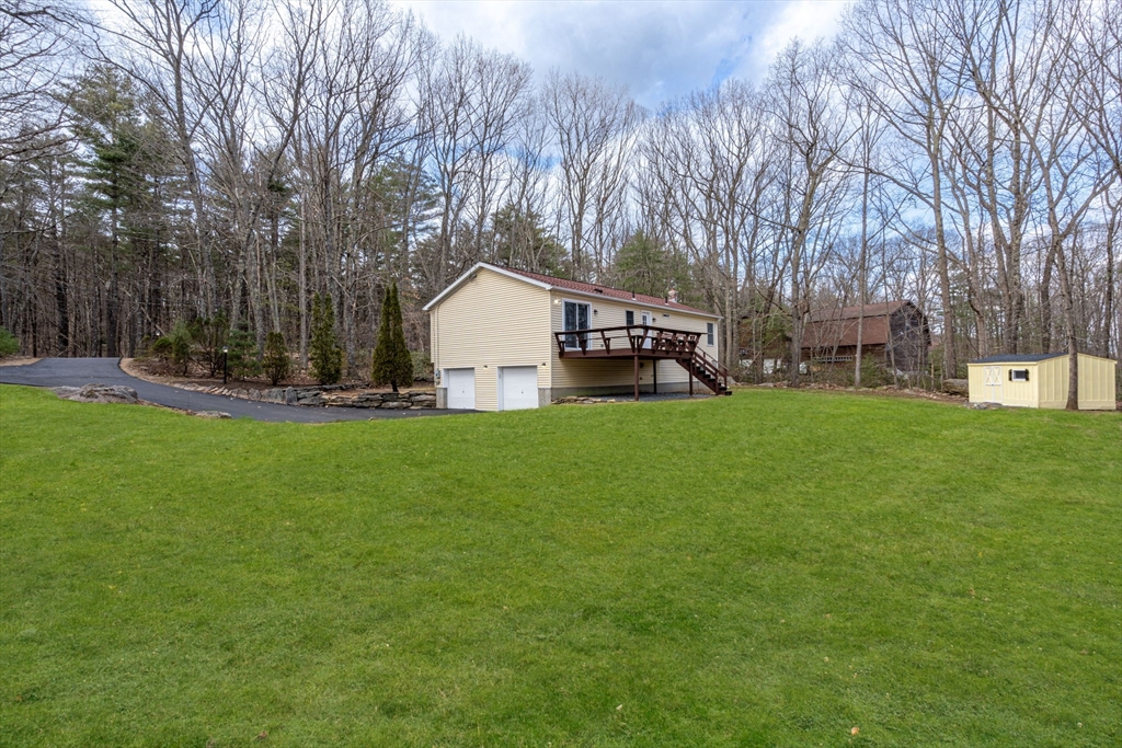 41 Casey Road Spencer, MA 01562 - Photo 35 of 39 a view of a house with a yard and sitting area