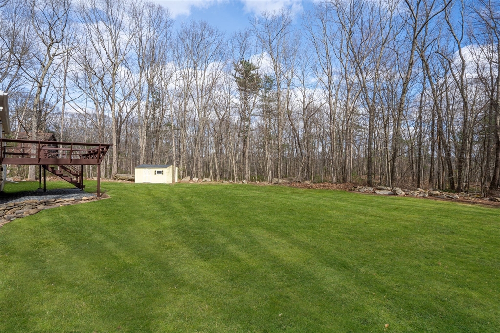 41 Casey Road Spencer, MA 01562 - Photo 36 of 39 a view of yard with grass and trees