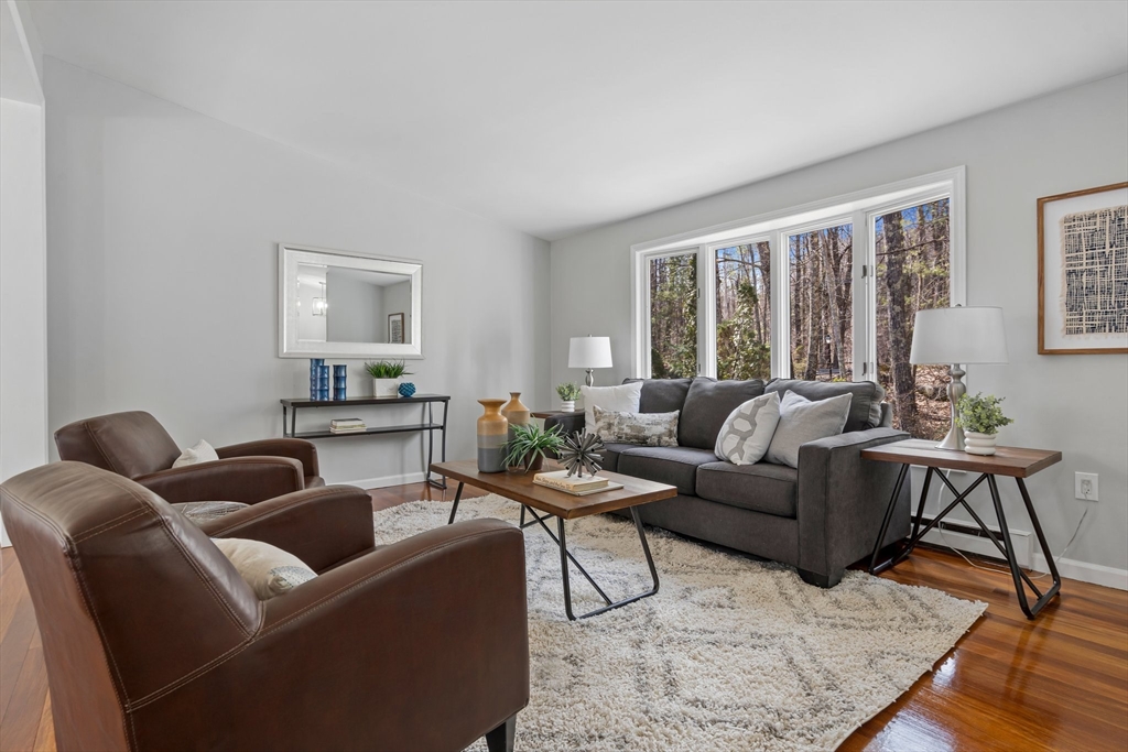 41 Casey Road Spencer, MA 01562 - Photo 39 of 39 a living room with furniture and a large window