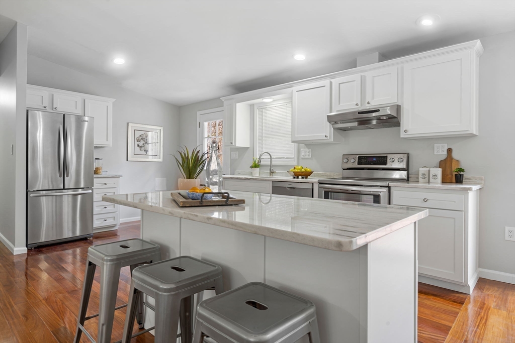41 Casey Road Spencer, MA 01562 - Photo 6 of 39 a kitchen with stainless steel appliances a sink a stove a refrigerator and cabinets