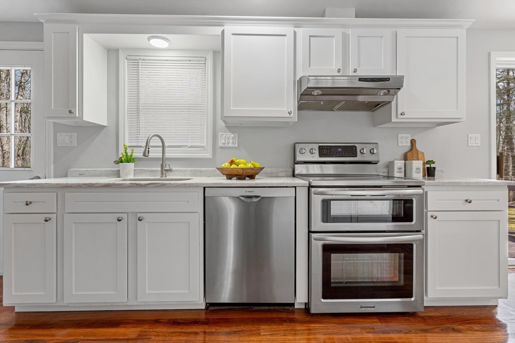 41 Casey Road Spencer, MA 01562 - Photo 8 of 39 a kitchen with stainless steel appliances granite countertop a sink a stove and cabinets