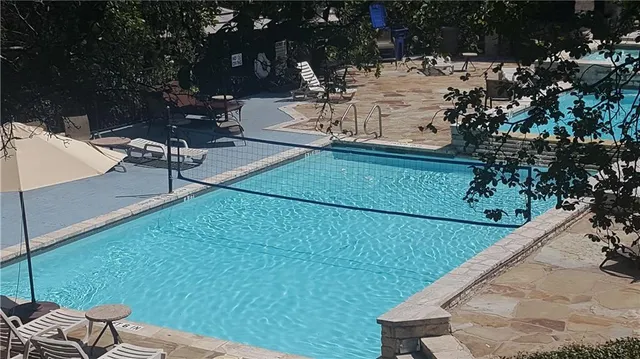 a view of backyard with sitting area