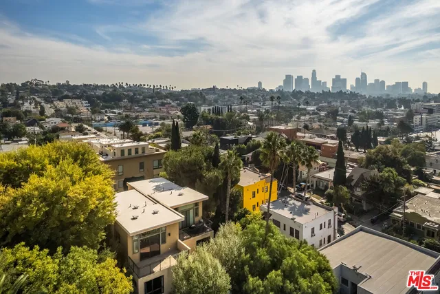 an aerial view of a house with lots of trees