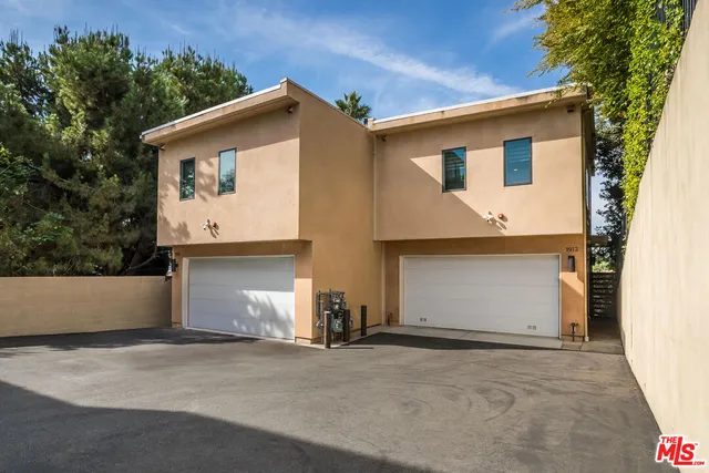 a front view of house with garage