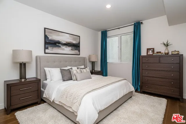 a bedroom with a bed and a closet