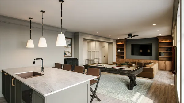 a kitchen with a stove a sink a dining table and chairs