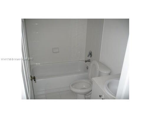 2314 Southeast 23rd Road, Unit 2314 Homestead, FL 33035 - Photo 11 of 13 a bathroom with a sink and a vanity