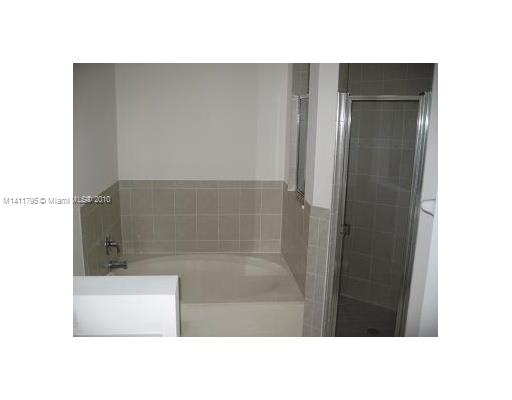 2314 Southeast 23rd Road, Unit 2314 Homestead, FL 33035 - Photo 9 of 13 a bathroom with a shower and a sink