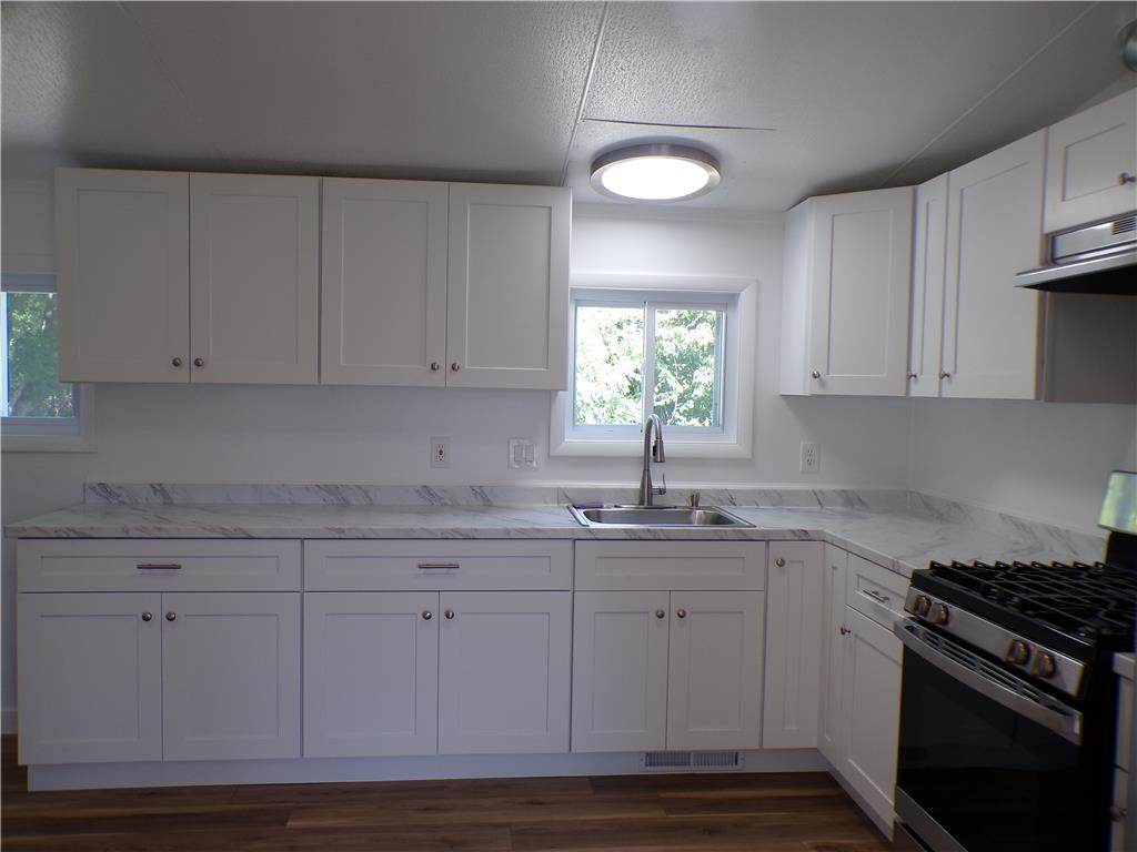 7877 Gun Club Road New Tripoli, PA 18066 - Photo 5 of 19 White cabinetry with ample storage highlights this efficient kitchen layout.