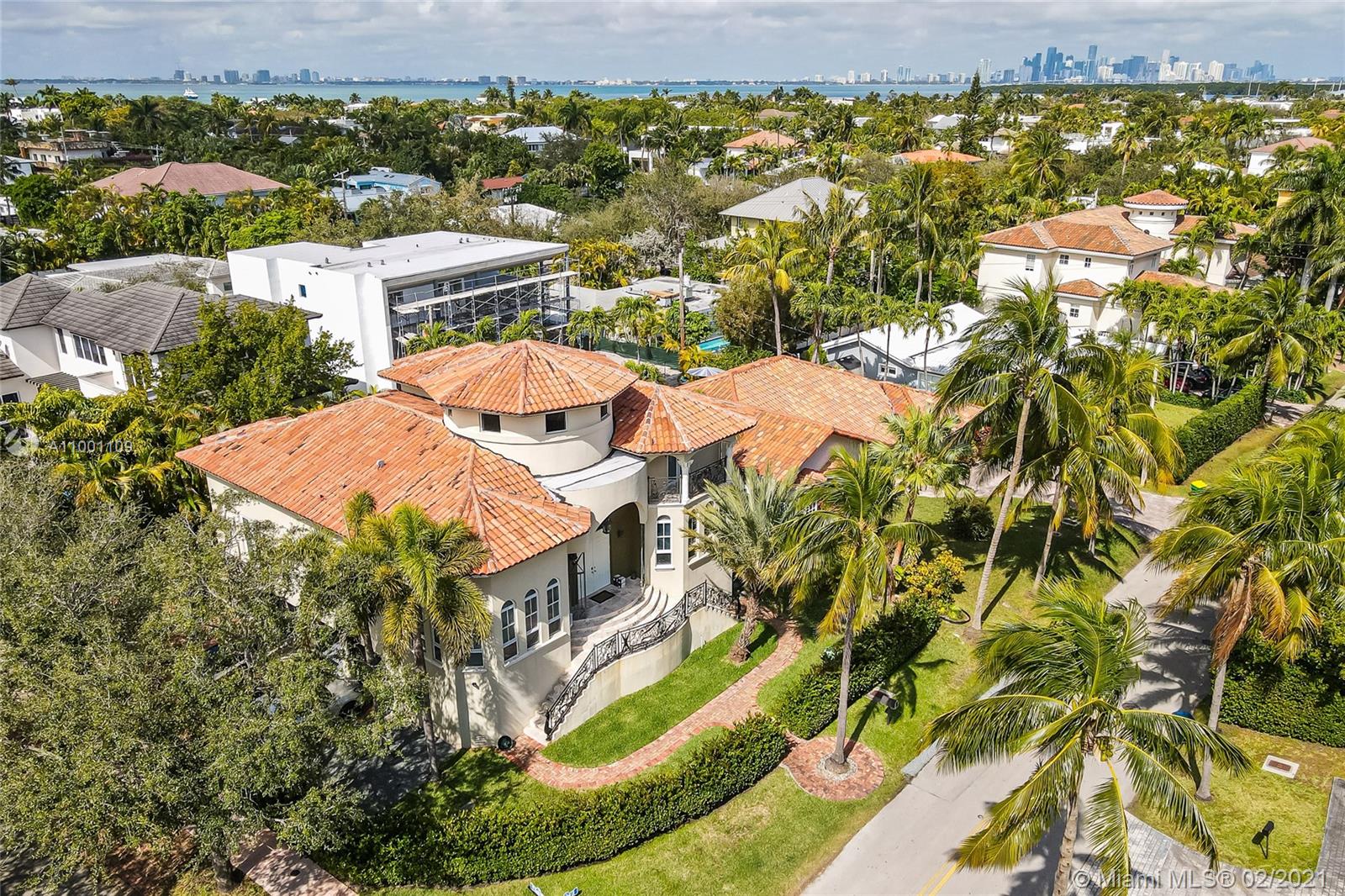 an aerial view of residential houses with yard