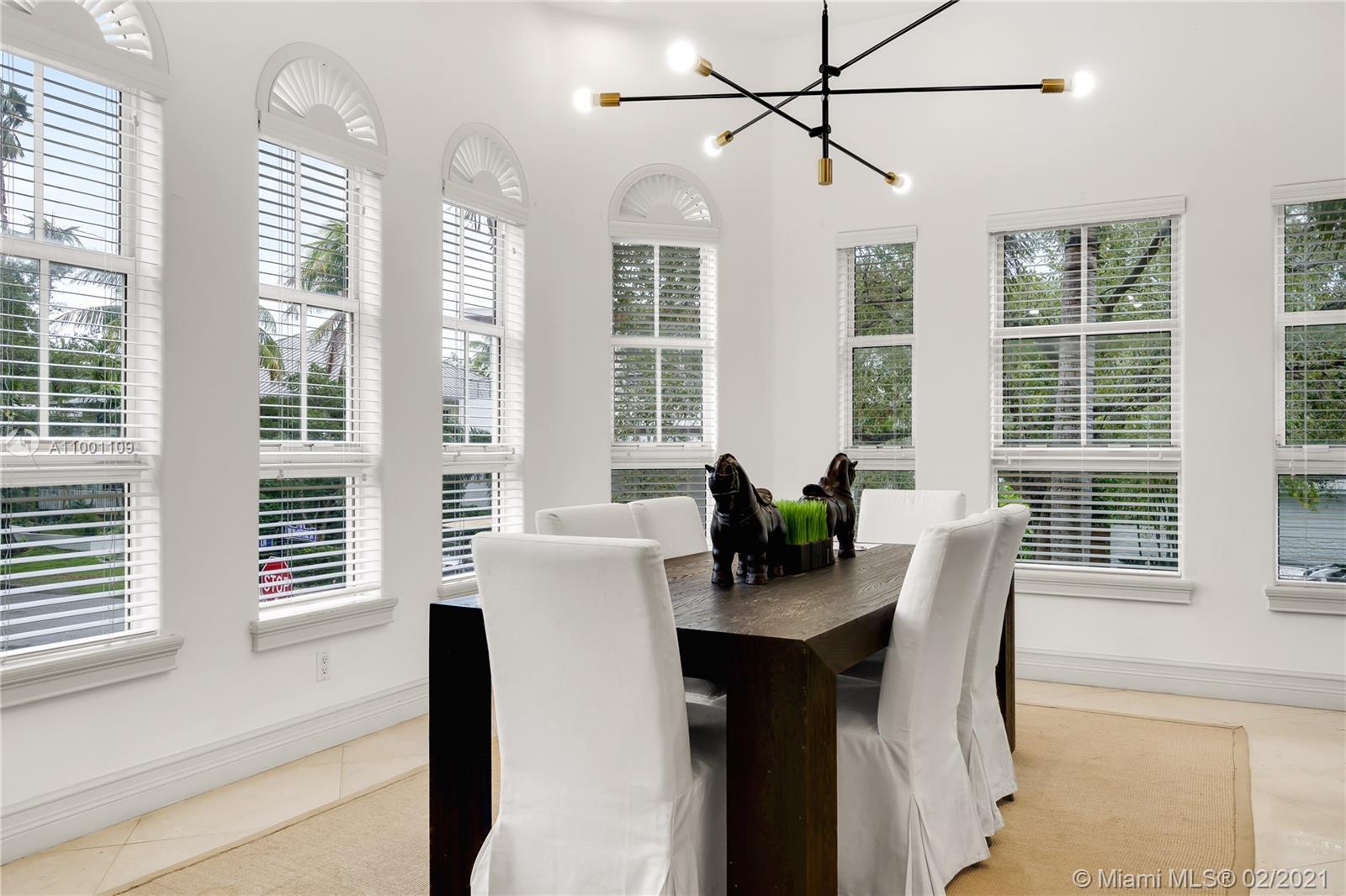 570 Hampton Lane Key Biscayne, FL 33149 - Photo 13 of 60 a dining room with furniture and window