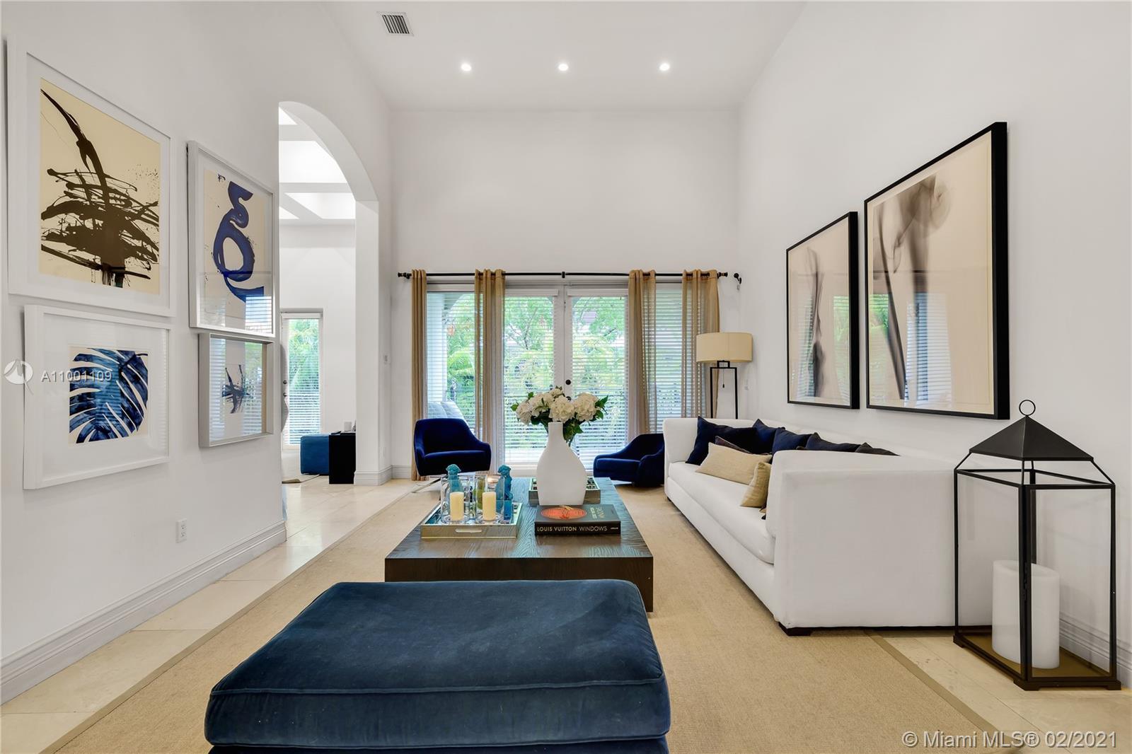 570 Hampton Lane Key Biscayne, FL 33149 - Photo 16 of 60 a living room with furniture and large windows