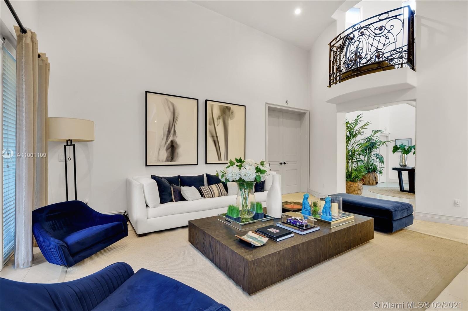 570 Hampton Lane Key Biscayne, FL 33149 - Photo 17 of 60 a living room with furniture and a large window