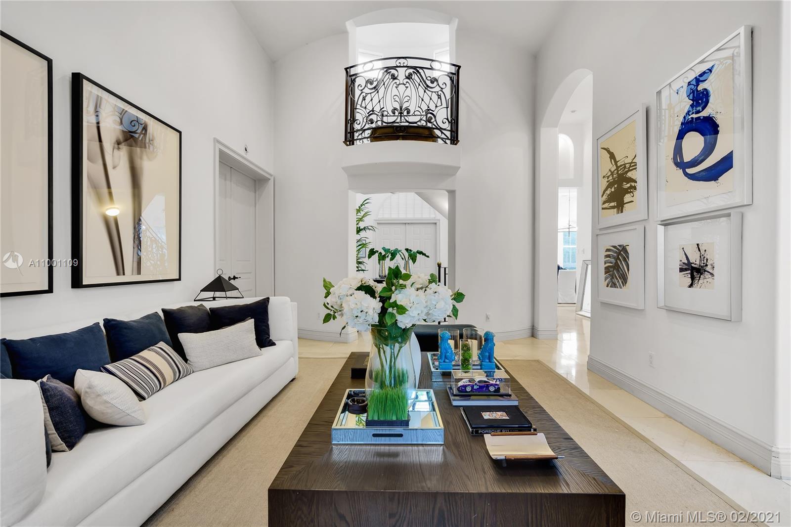 570 Hampton Lane Key Biscayne, FL 33149 - Photo 18 of 60 a living room with furniture and flowers