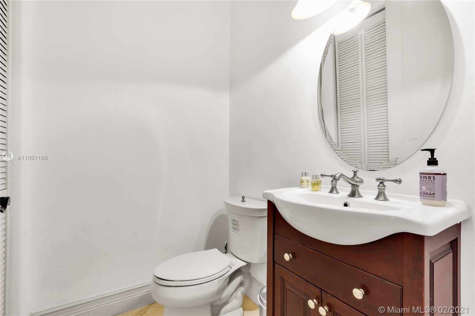 570 Hampton Lane Key Biscayne, FL 33149 - Photo 19 of 60 a bathroom with a sink mirror and toilet