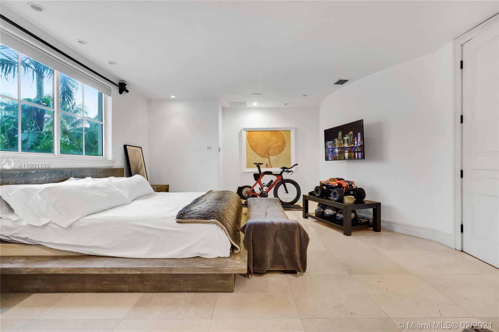 570 Hampton Lane Key Biscayne, FL 33149 - Photo 23 of 60 a bedroom with two beds and a large window