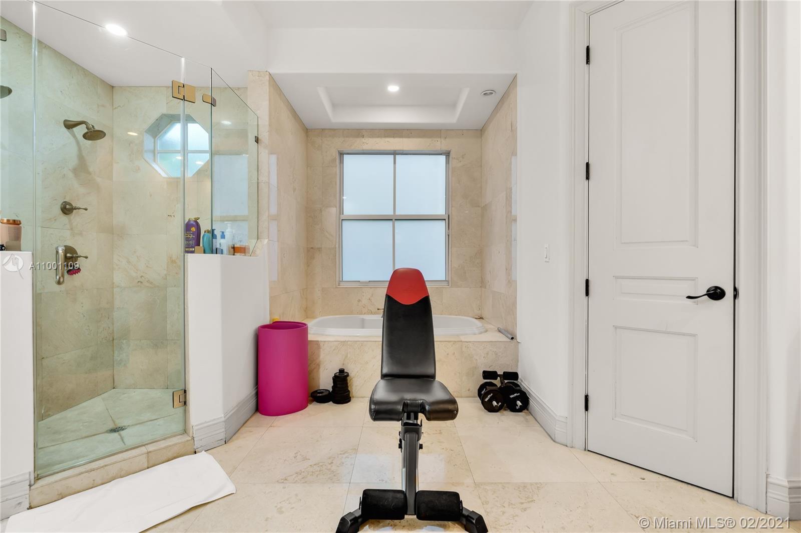 570 Hampton Lane Key Biscayne, FL 33149 - Photo 25 of 60 a bathroom with a sink and shower