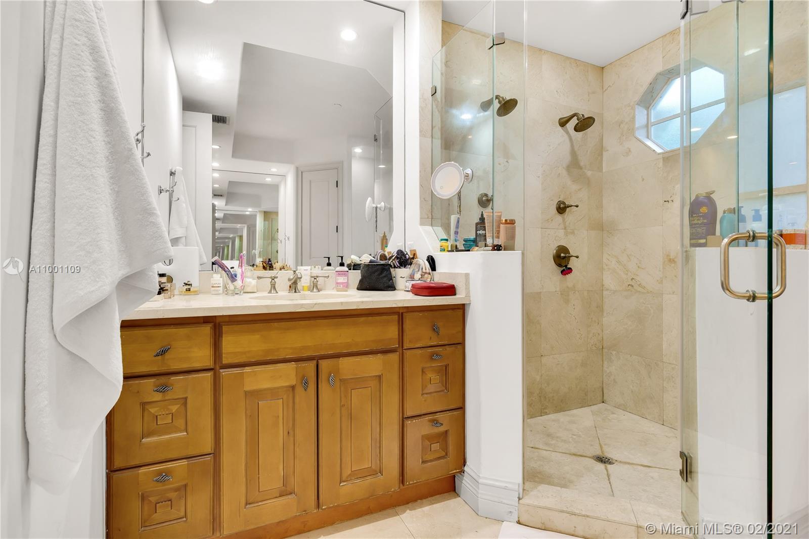 570 Hampton Lane Key Biscayne, FL 33149 - Photo 26 of 60 a bathroom with a sink and a mirror