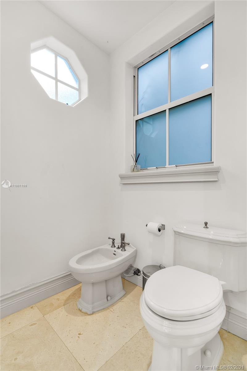 570 Hampton Lane Key Biscayne, FL 33149 - Photo 29 of 60 a bathroom with a toilet and a sink