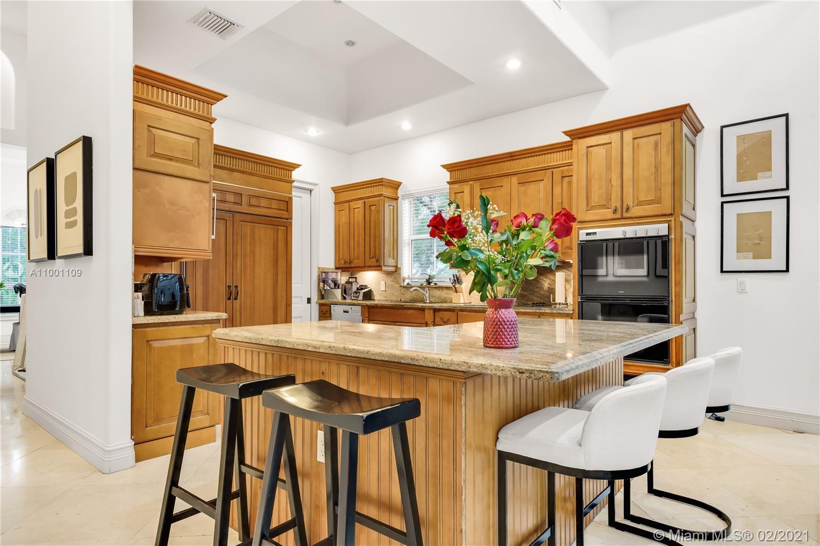 570 Hampton Lane Key Biscayne, FL 33149 - Photo 33 of 60 a dining room with furniture and a potted plant