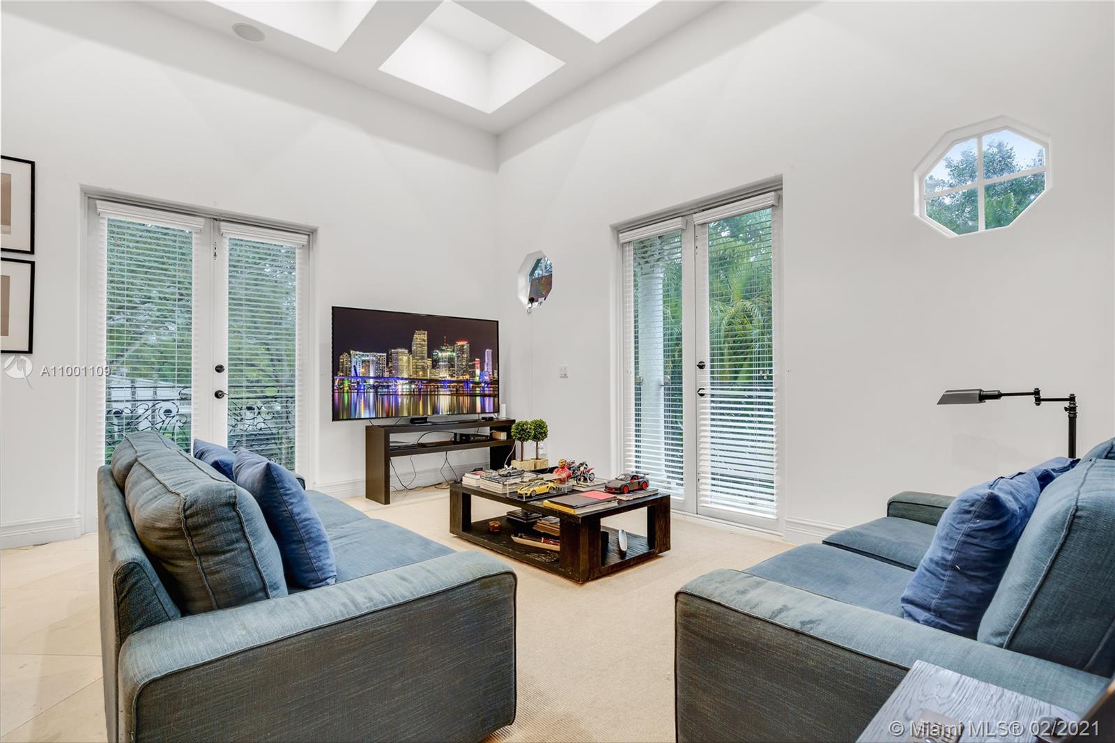 570 Hampton Lane Key Biscayne, FL 33149 - Photo 34 of 60 a living room with furniture and a flat screen tv