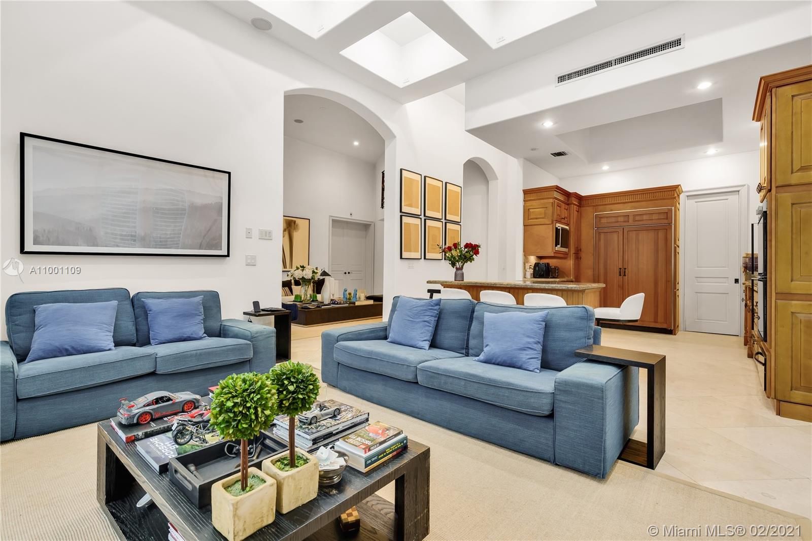 570 Hampton Lane Key Biscayne, FL 33149 - Photo 35 of 60 a living room with furniture potted plant and kitchen view