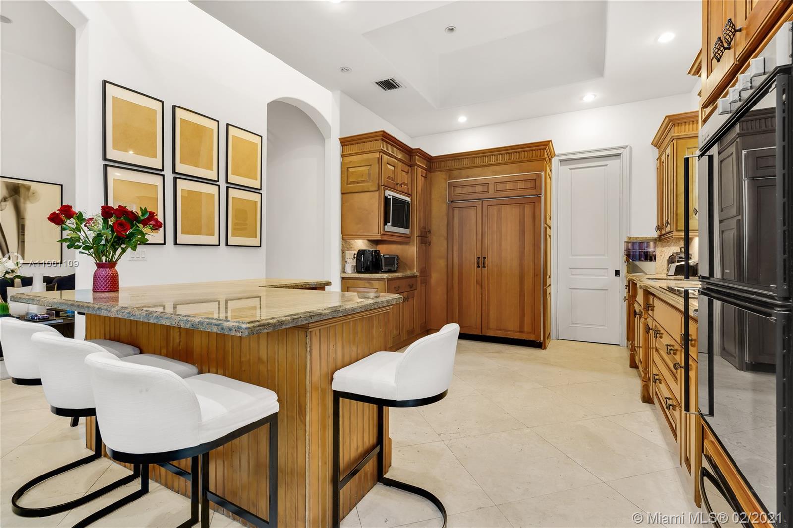 570 Hampton Lane Key Biscayne, FL 33149 - Photo 37 of 60 a kitchen with stainless steel appliances granite countertop a sink and a refrigerator