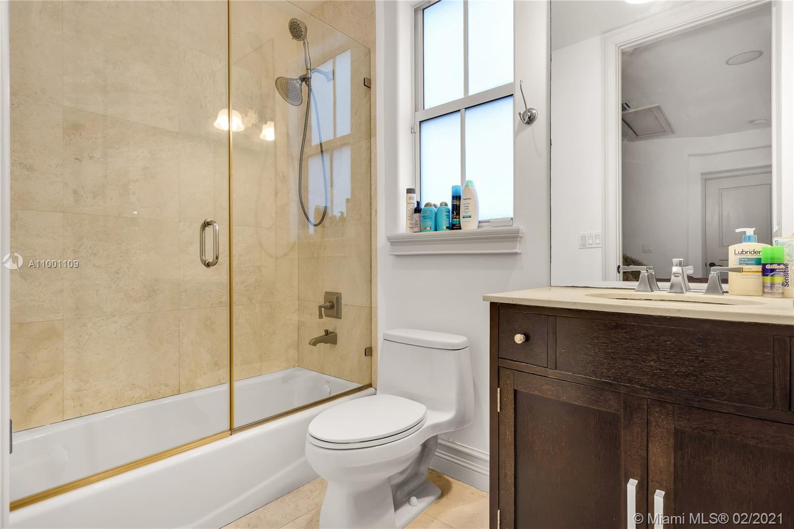 570 Hampton Lane Key Biscayne, FL 33149 - Photo 40 of 60 a bathroom with a sink a toilet and shower