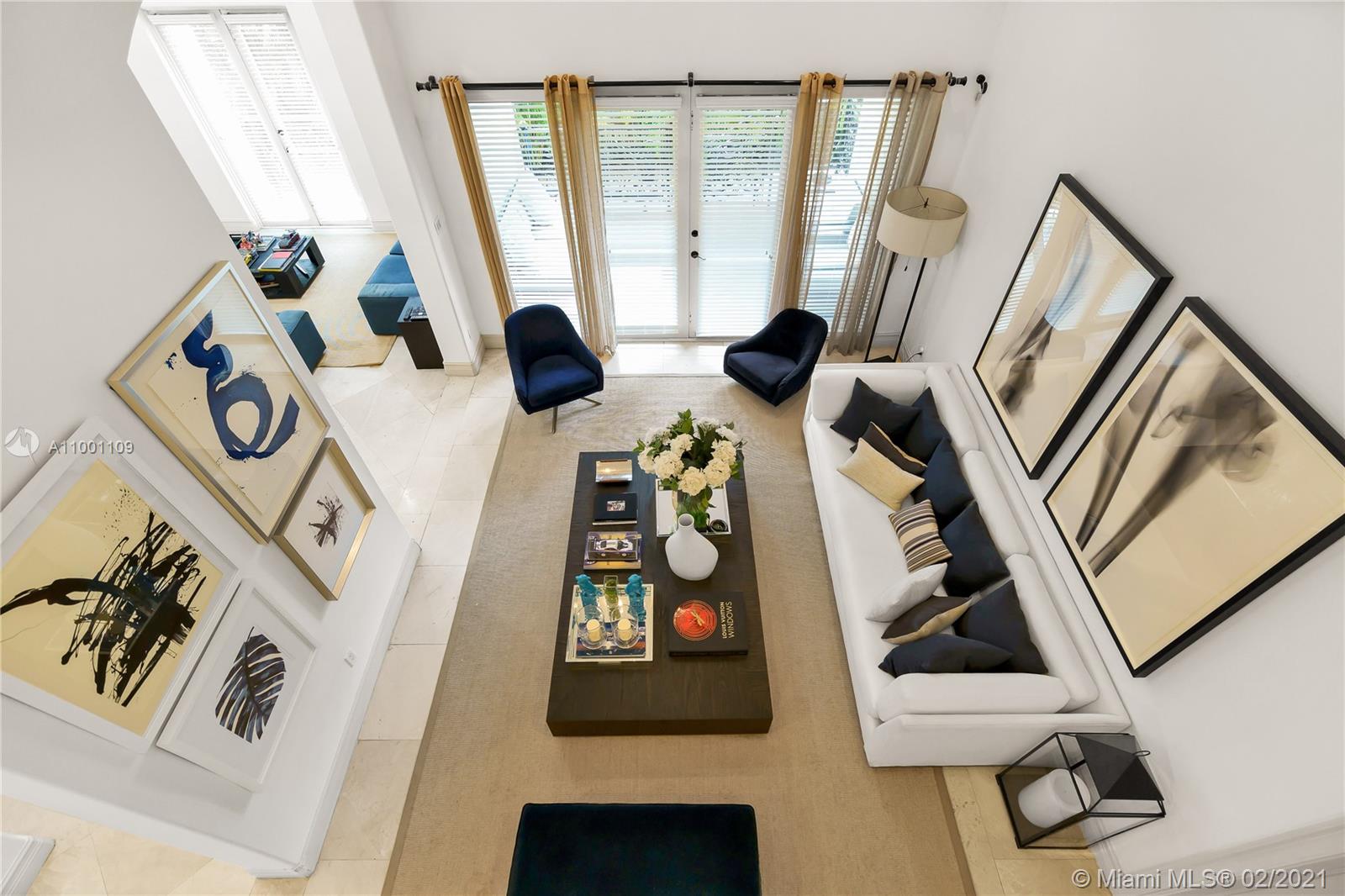 570 Hampton Lane Key Biscayne, FL 33149 - Photo 46 of 60 a view of an entryway with wooden floor