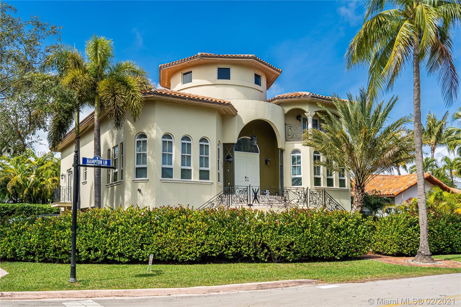 570 Hampton Lane Key Biscayne, FL 33149 - Photo 6 of 60 a front view of a house with a yard
