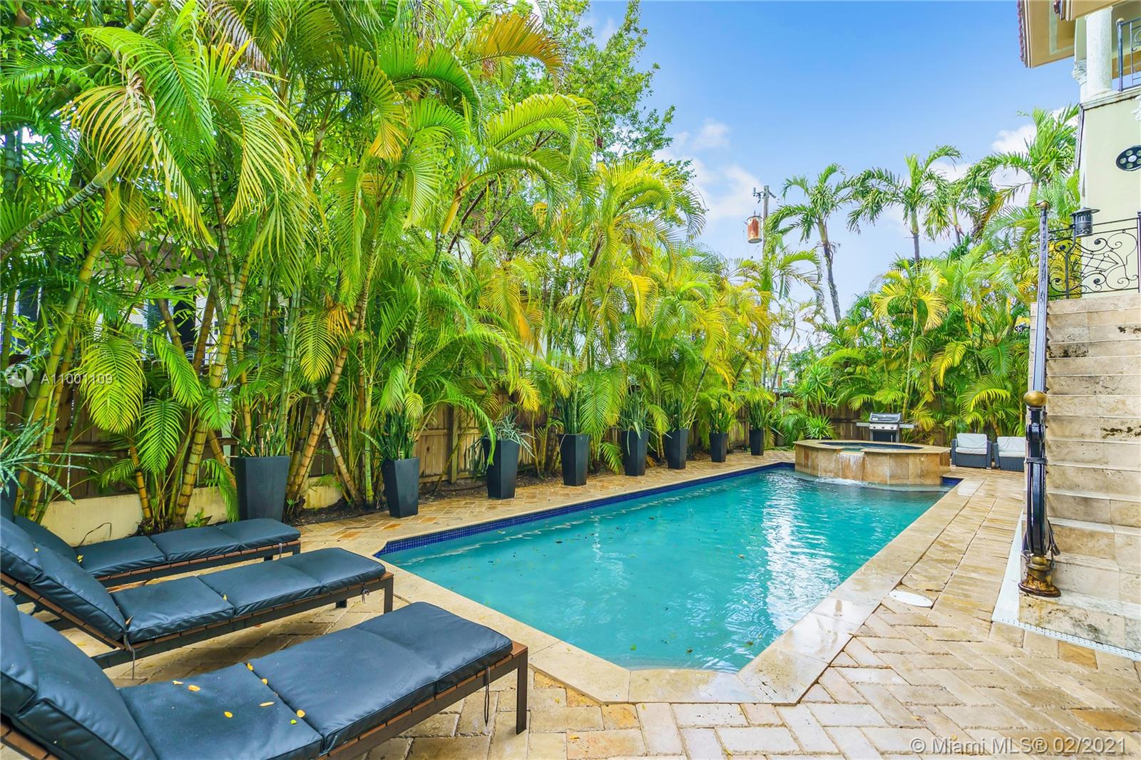 570 Hampton Lane Key Biscayne, FL 33149 - Photo 52 of 60 a view of a backyard with swimming pool