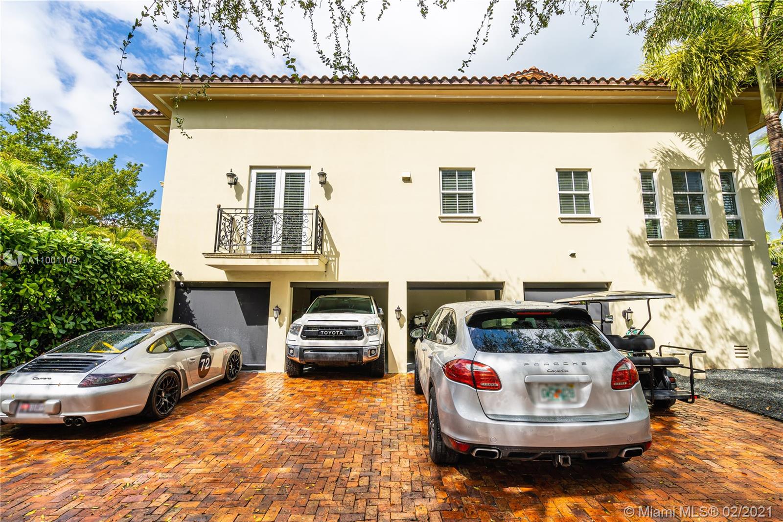 570 Hampton Lane Key Biscayne, FL 33149 - Photo 57 of 60 a car parked on the side of the road