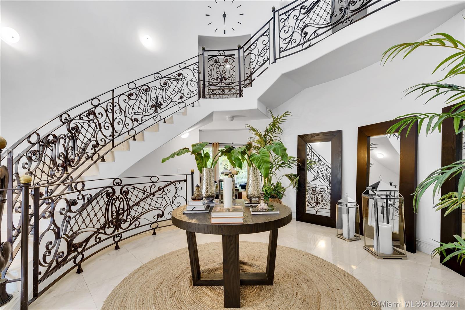 570 Hampton Lane Key Biscayne, FL 33149 - Photo 7 of 60 a view of a chairs and table in a patio