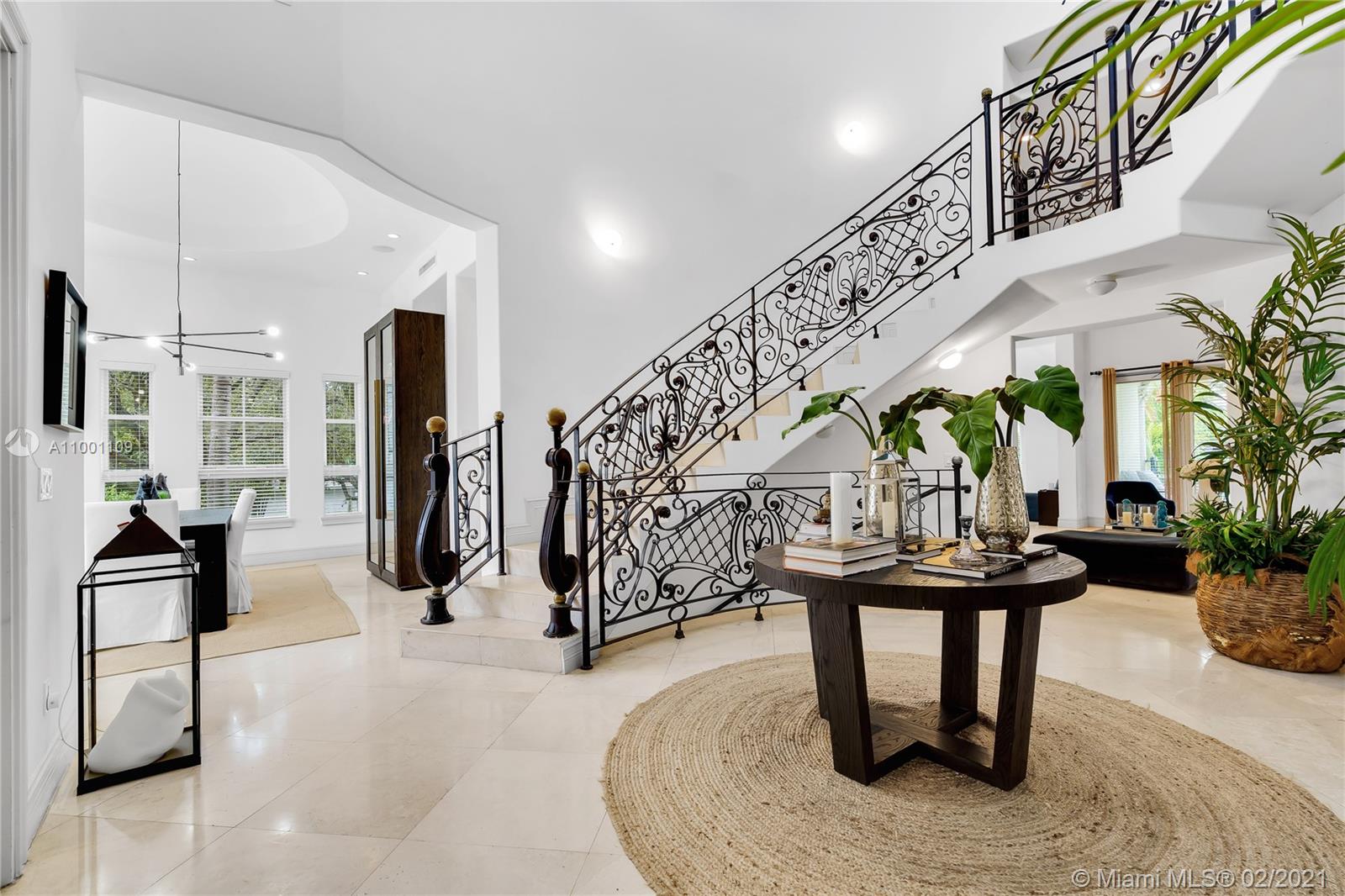 570 Hampton Lane Key Biscayne, FL 33149 - Photo 9 of 60 a dining room with furniture and entryway